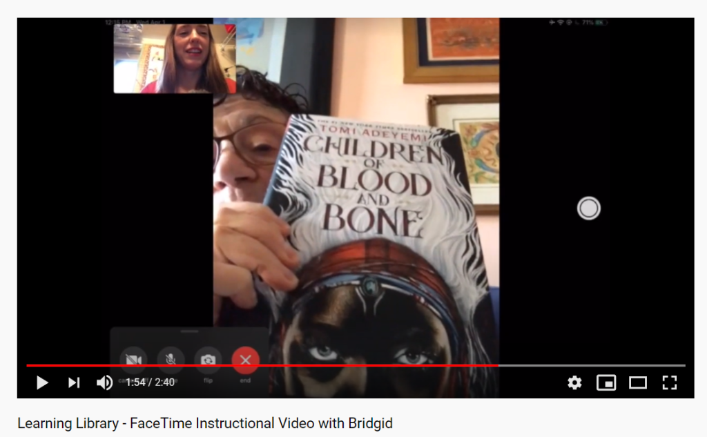 A screenshot from the FaceTime Instructional Video featuring my mother-in-law showing off her latest favorite book, Tomi Adeyemi's Children of Blood and Bone